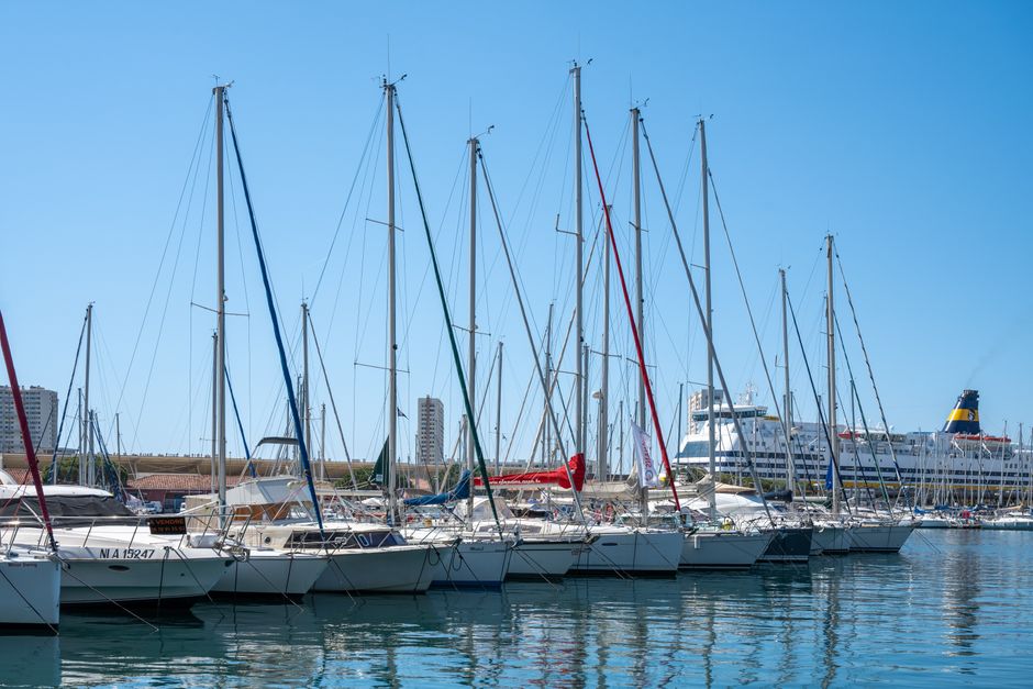 Scenic view of sailboats at Toulon Marina, Provence, under a clear blue sky.