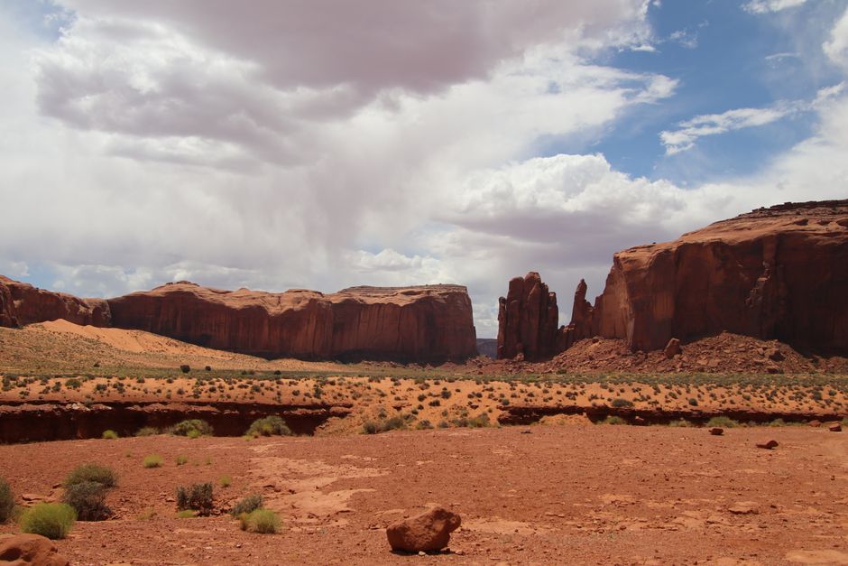 Majestic red rock formations under a dramatic sky in Monument Valley.