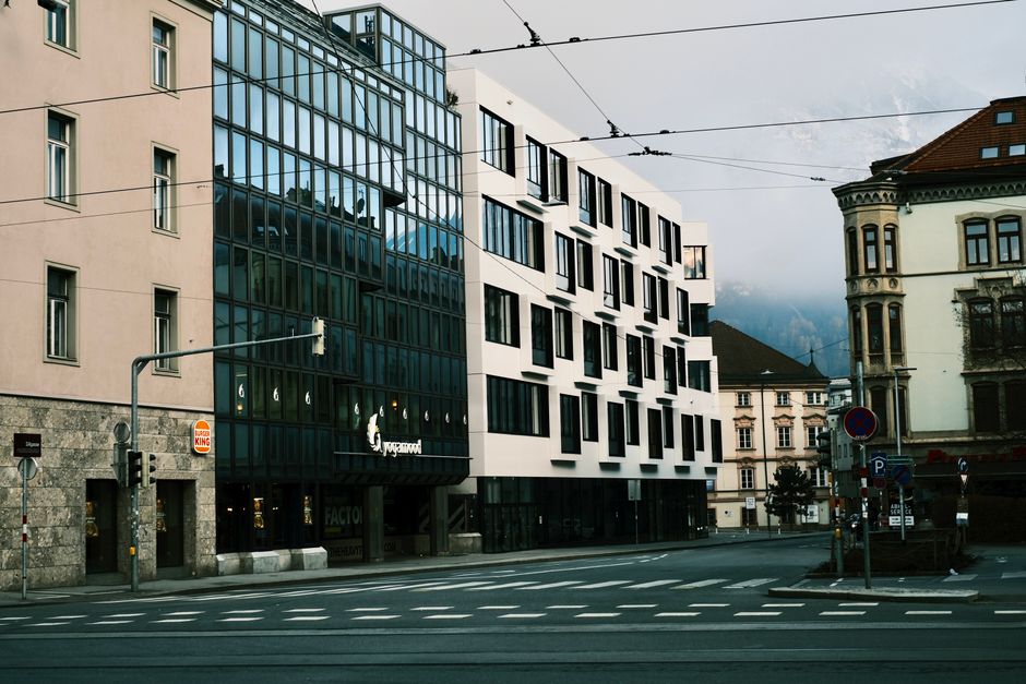 Contemporary urban scene depicting modern architecture on a city street in Innsbruck, Austria.