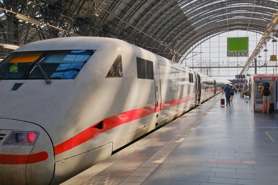 A sleek high-speed train at a bustling European railway station, capturing travel and transportation themes.