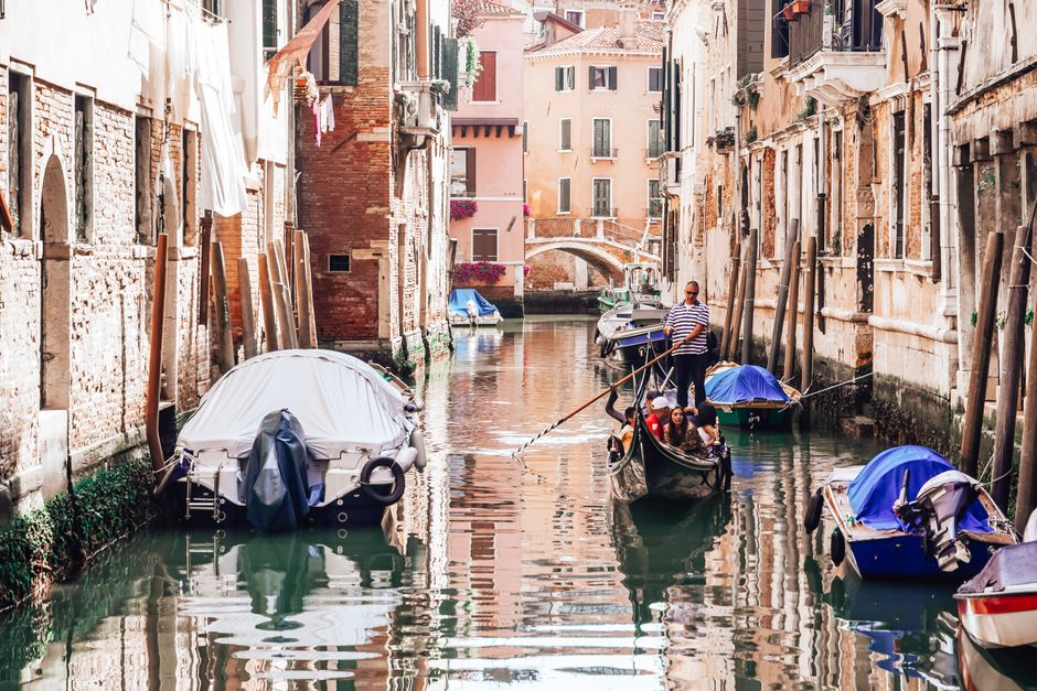 Experience a classic gondola ride through the picturesque canals of Venice.
