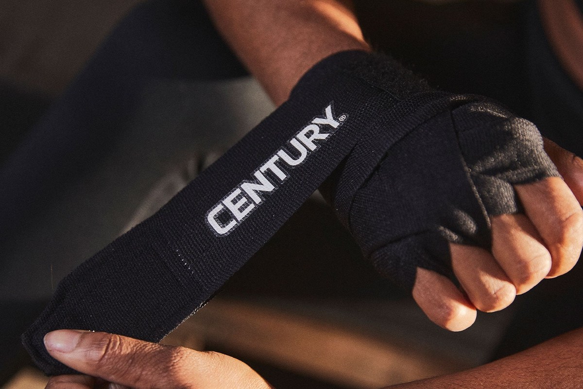 Hand wraps ready beside martial arts training equipment