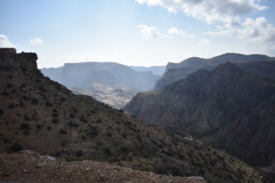 Explore the rugged beauty of a dramatic mountain range under a vibrant sky.
